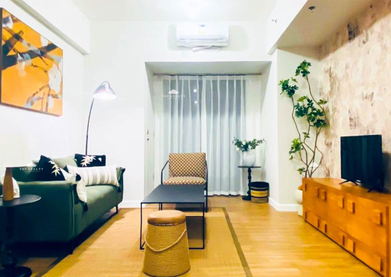 Elevate your lifestyle in this fully furnished high-floor condo unit in Pasig