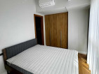 Fully-furnished 2-bedroom condo with balcony and parking for sale
