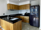 Fully-furnished 2-bedroom condo with balcony and parking for sale