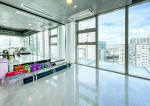 fully furnished condo with a balcony overlooking the city skyline