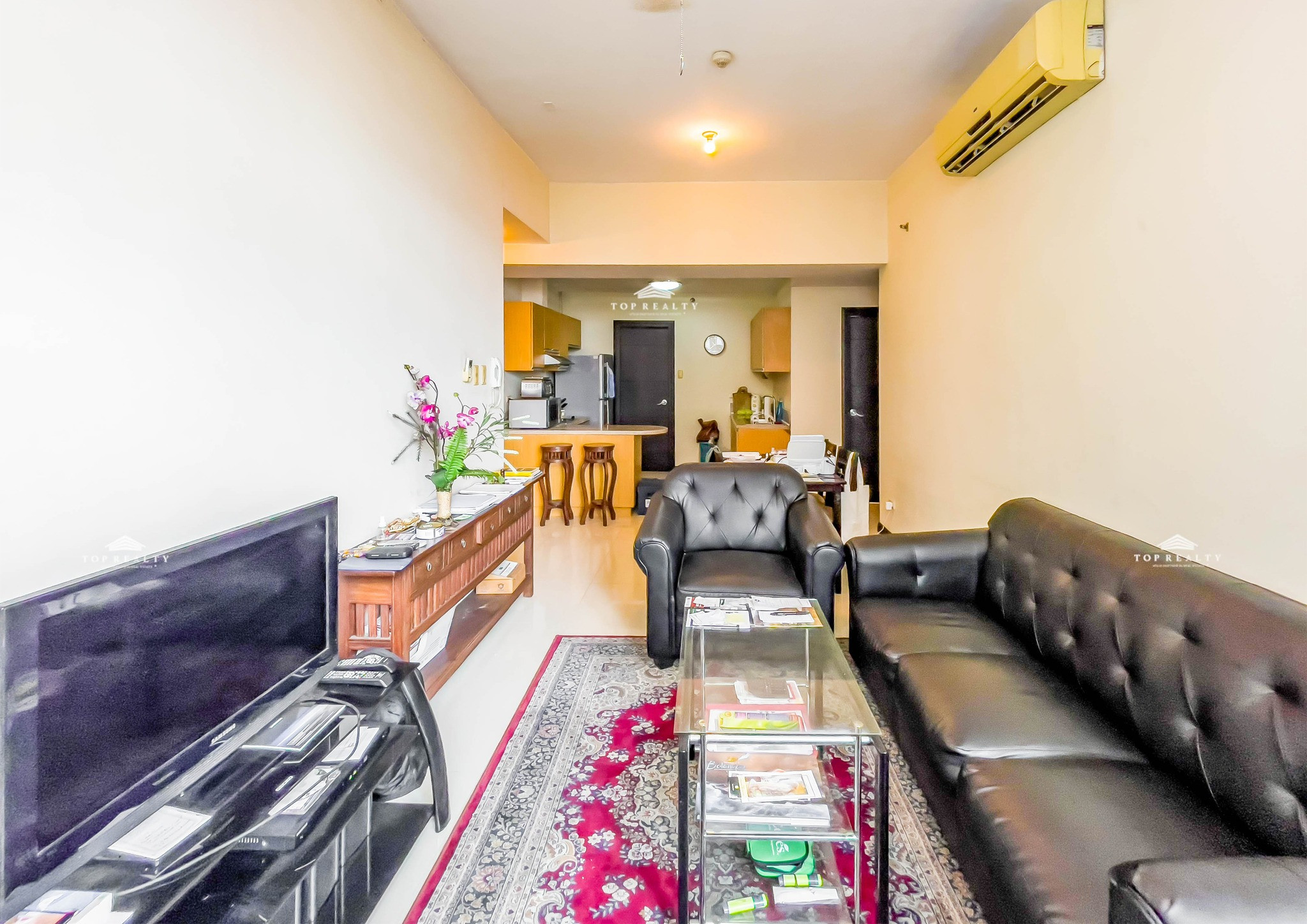 This semi-furnished condo comes with a spacious balcony photo 3
