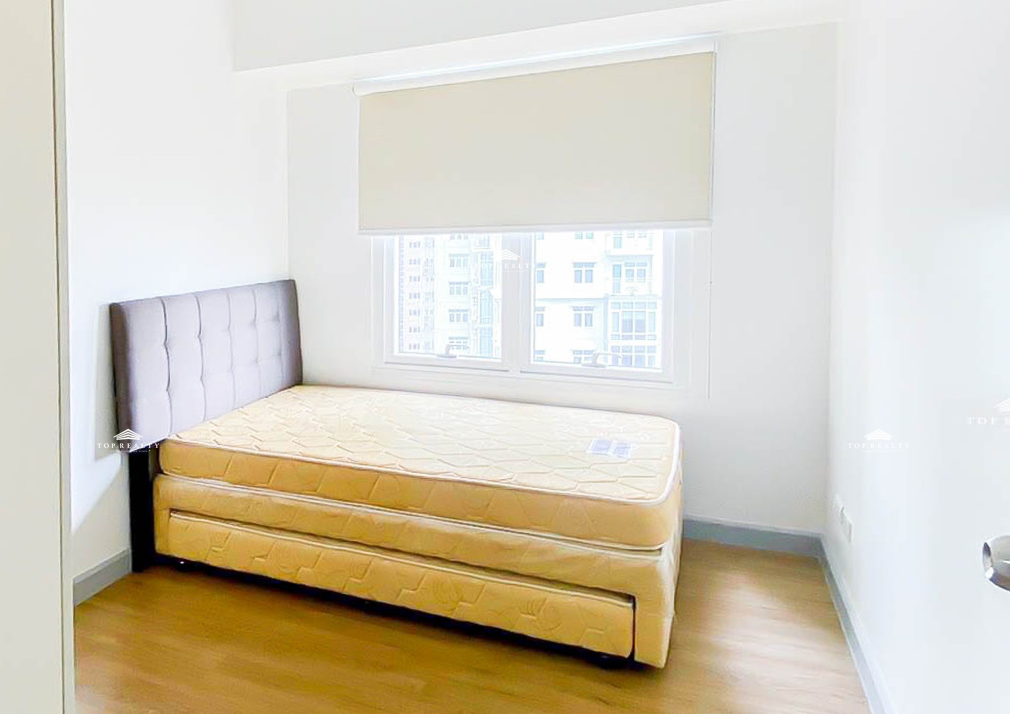 semi-furnished corner condo boasts a spacious balcony and a bedroom photo 4