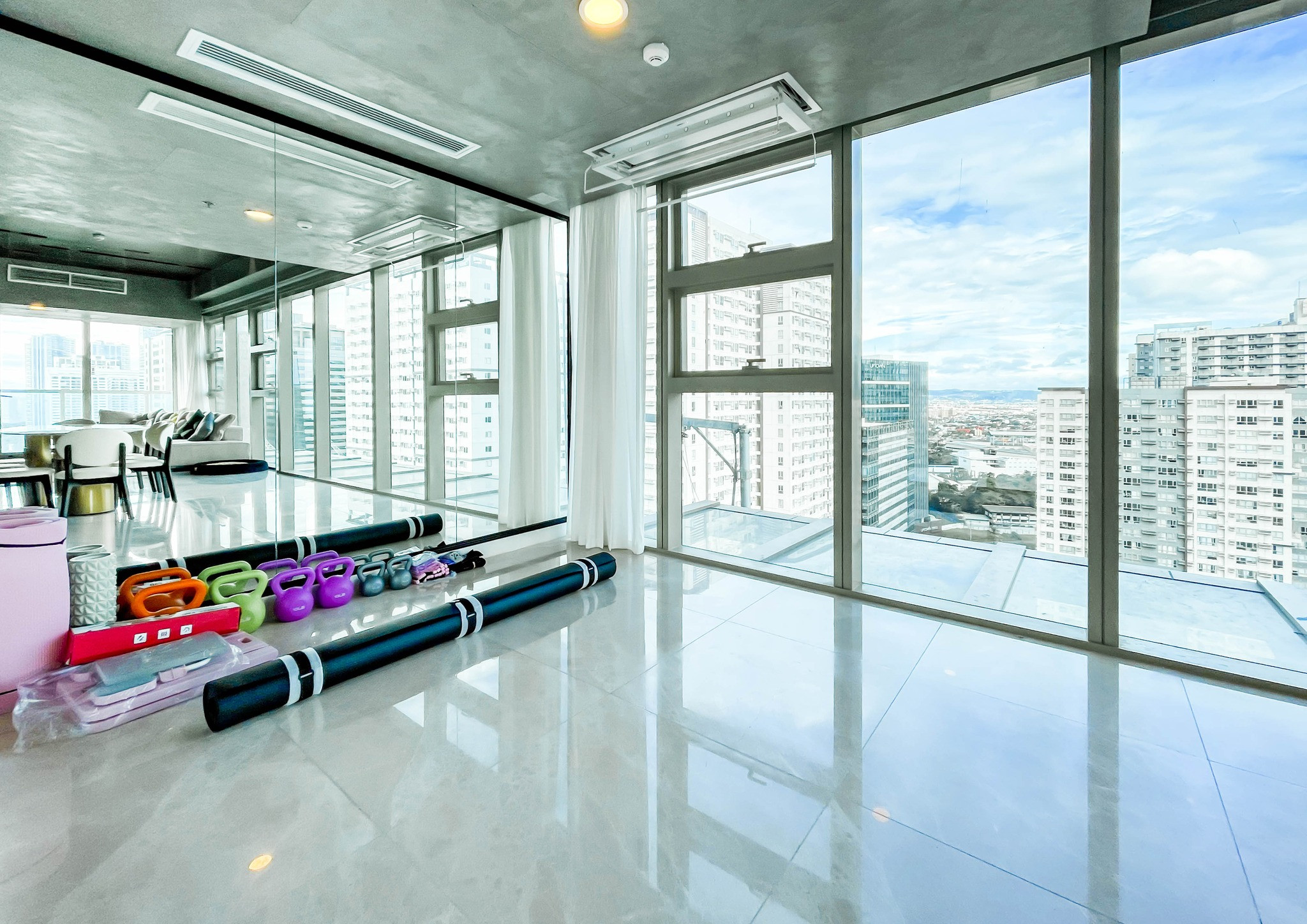 fully furnished condo with a balcony overlooking the city skyline photo 4