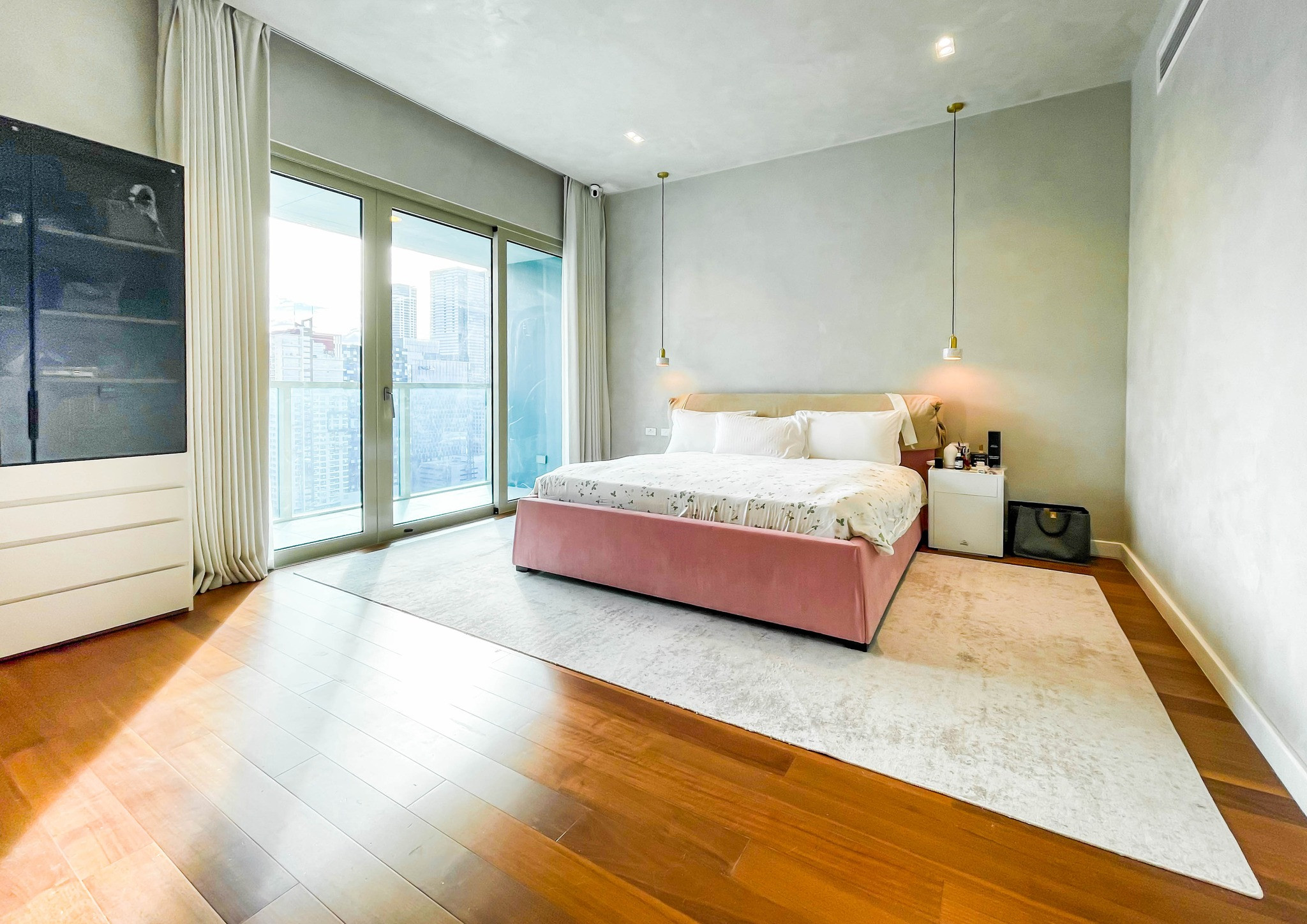 fully furnished condo with a balcony overlooking the city skyline photo 5